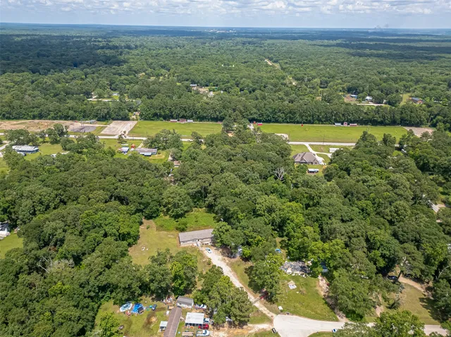 an aerial view of a house with swimming pool