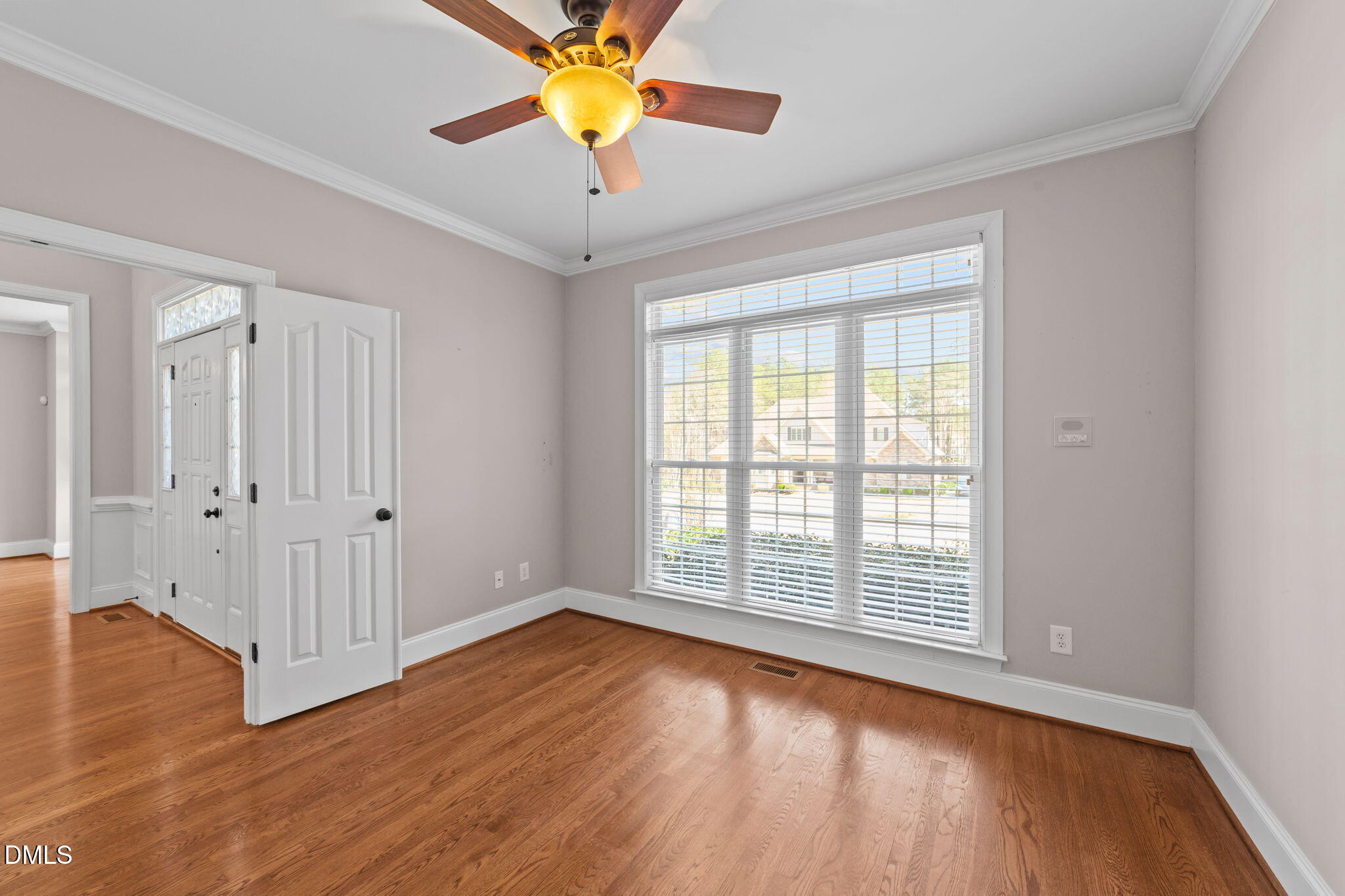 1405 Wakefield Farm Road Zebulon, NC 27597 - Photo 25 of 64 an empty room with wooden floor and windows