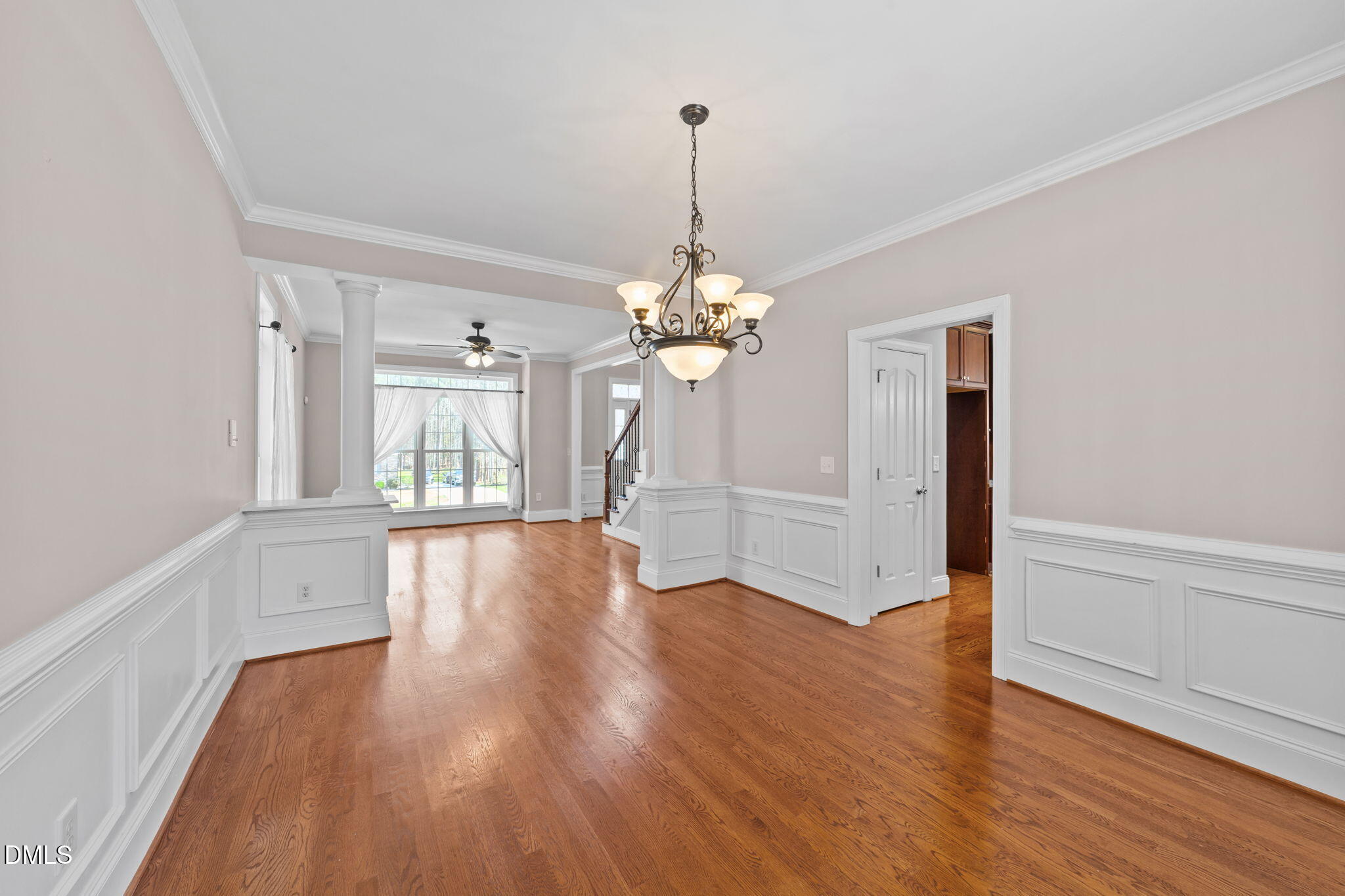1405 Wakefield Farm Road Zebulon, NC 27597 - Photo 31 of 64 a view of a room with wooden floor chandelier and windows