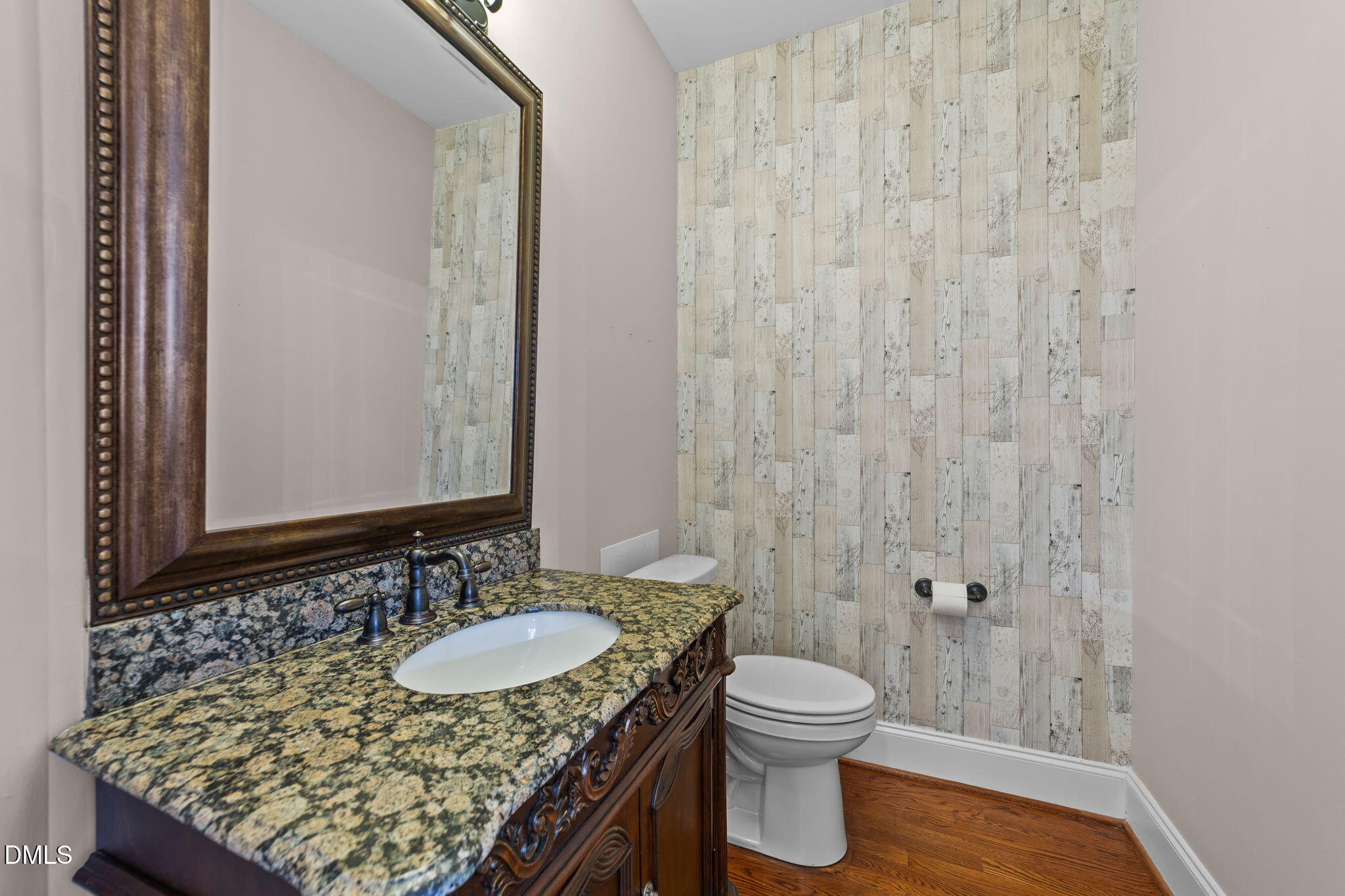 1405 Wakefield Farm Road Zebulon, NC 27597 - Photo 32 of 64 a bathroom with a granite countertop sink and a mirror