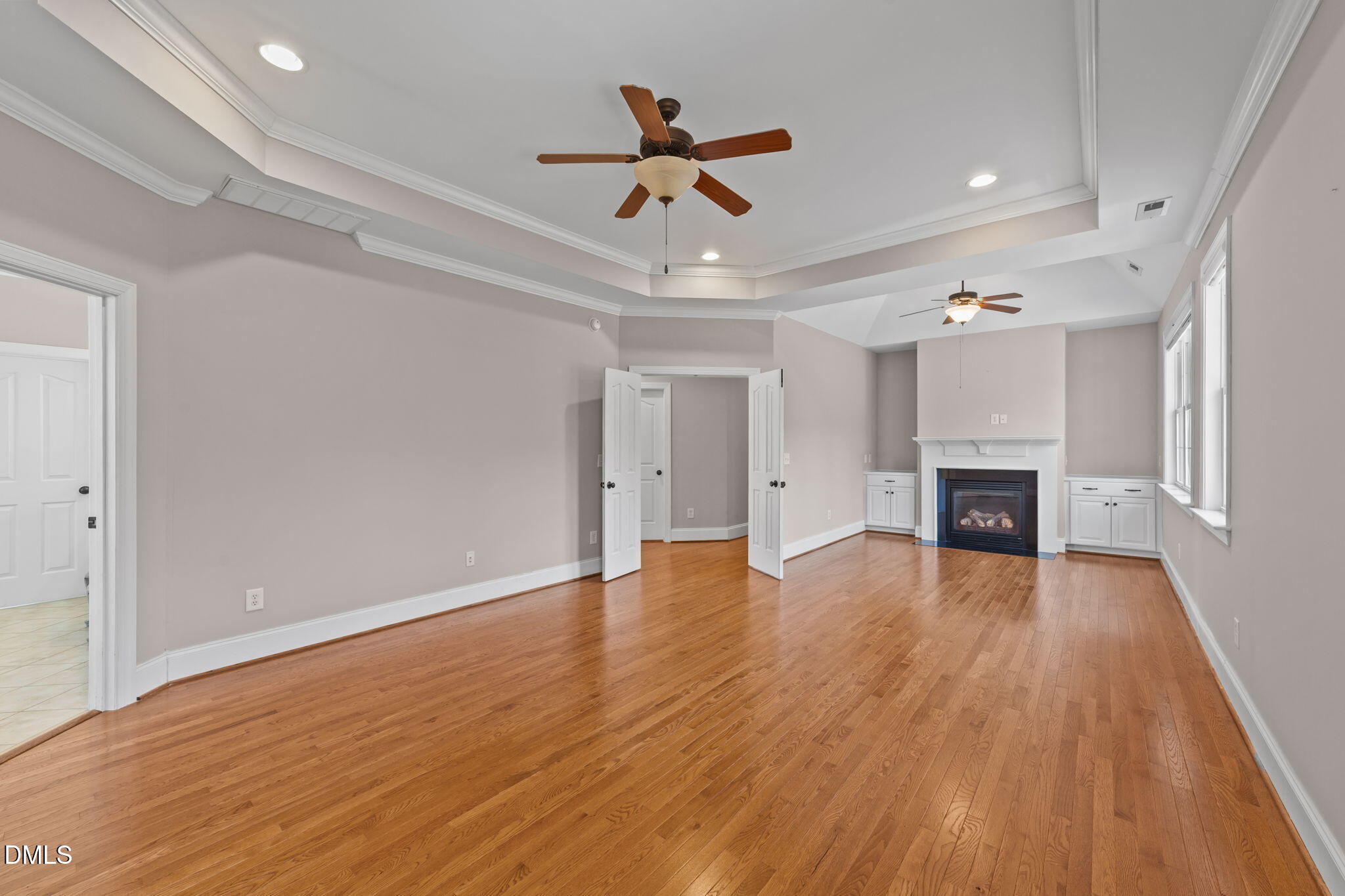 1405 Wakefield Farm Road Zebulon, NC 27597 - Photo 35 of 64 wooden floor in an empty room with a ceiling fan