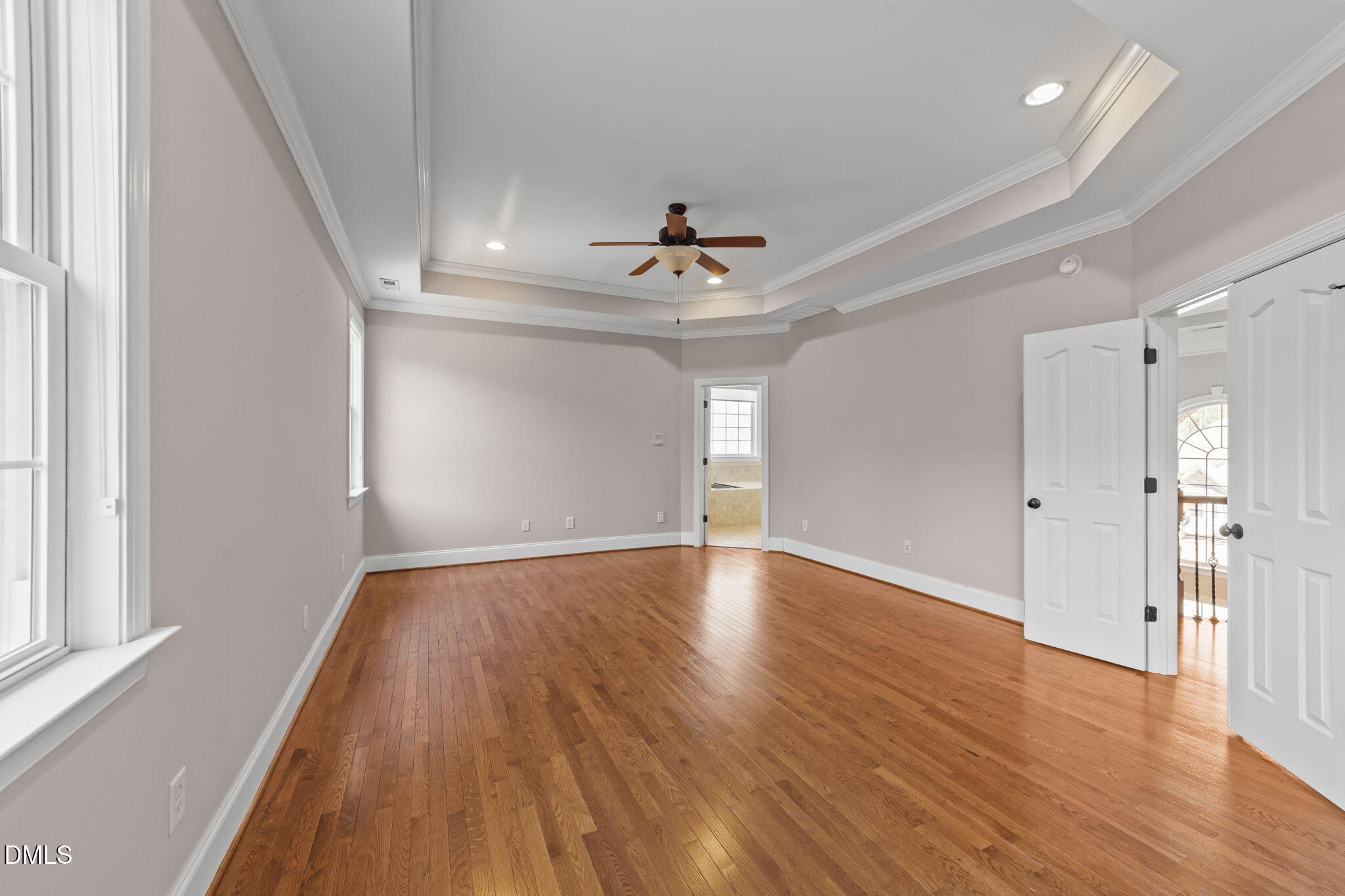 1405 Wakefield Farm Road Zebulon, NC 27597 - Photo 36 of 64 a view of an empty room with wooden floor and a window