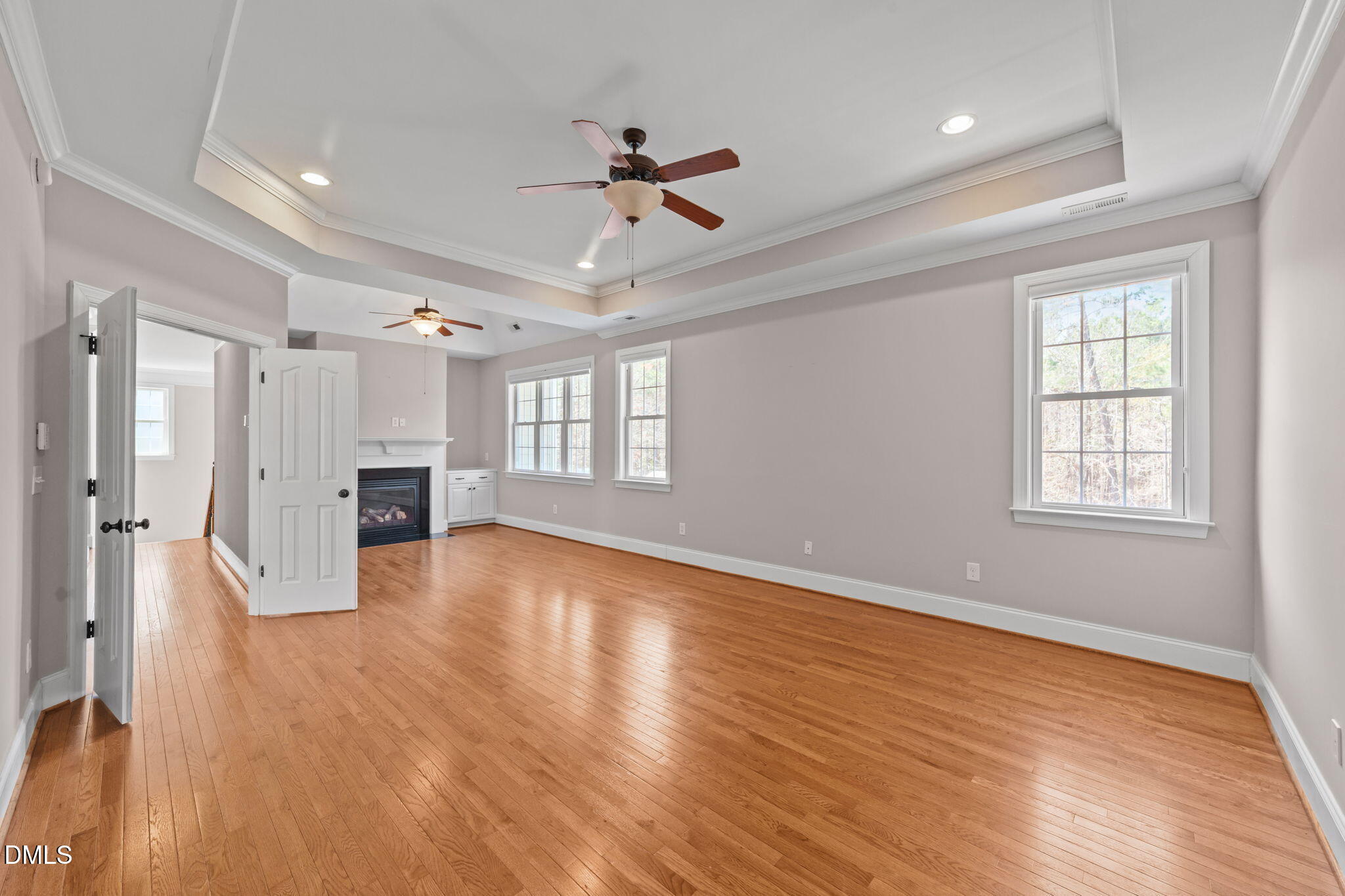 1405 Wakefield Farm Road Zebulon, NC 27597 - Photo 37 of 64 a view of an empty room with wooden floor and a window