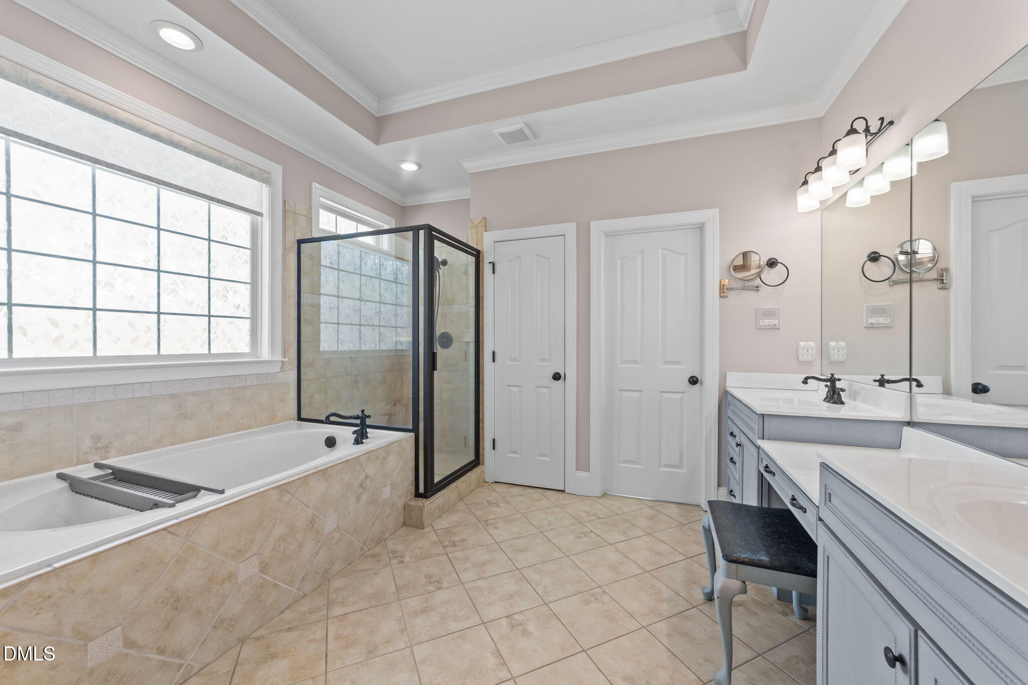 1405 Wakefield Farm Road Zebulon, NC 27597 - Photo 38 of 64 a spacious bathroom with a tub sink shower and mirror