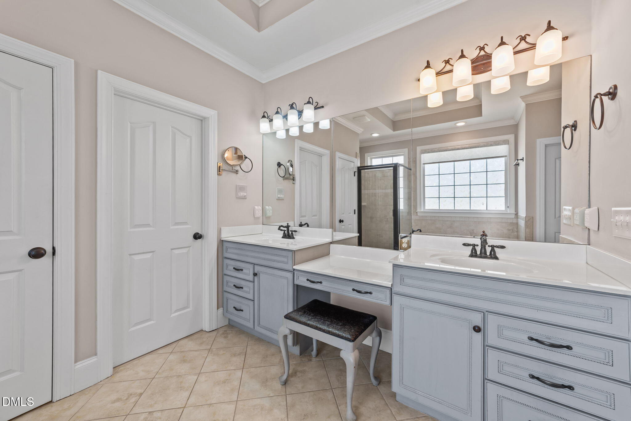 1405 Wakefield Farm Road Zebulon, NC 27597 - Photo 39 of 64 a spacious bathroom with a granite countertop double vanity sink a mirror and a bathtub