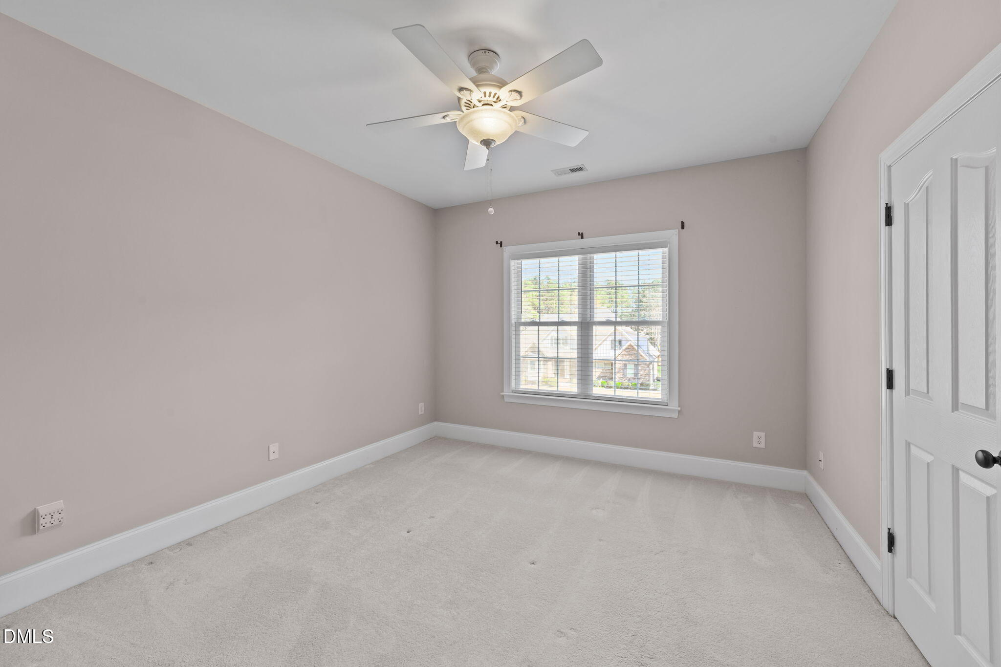 1405 Wakefield Farm Road Zebulon, NC 27597 - Photo 43 of 64 wooden floor in an empty room with a window
