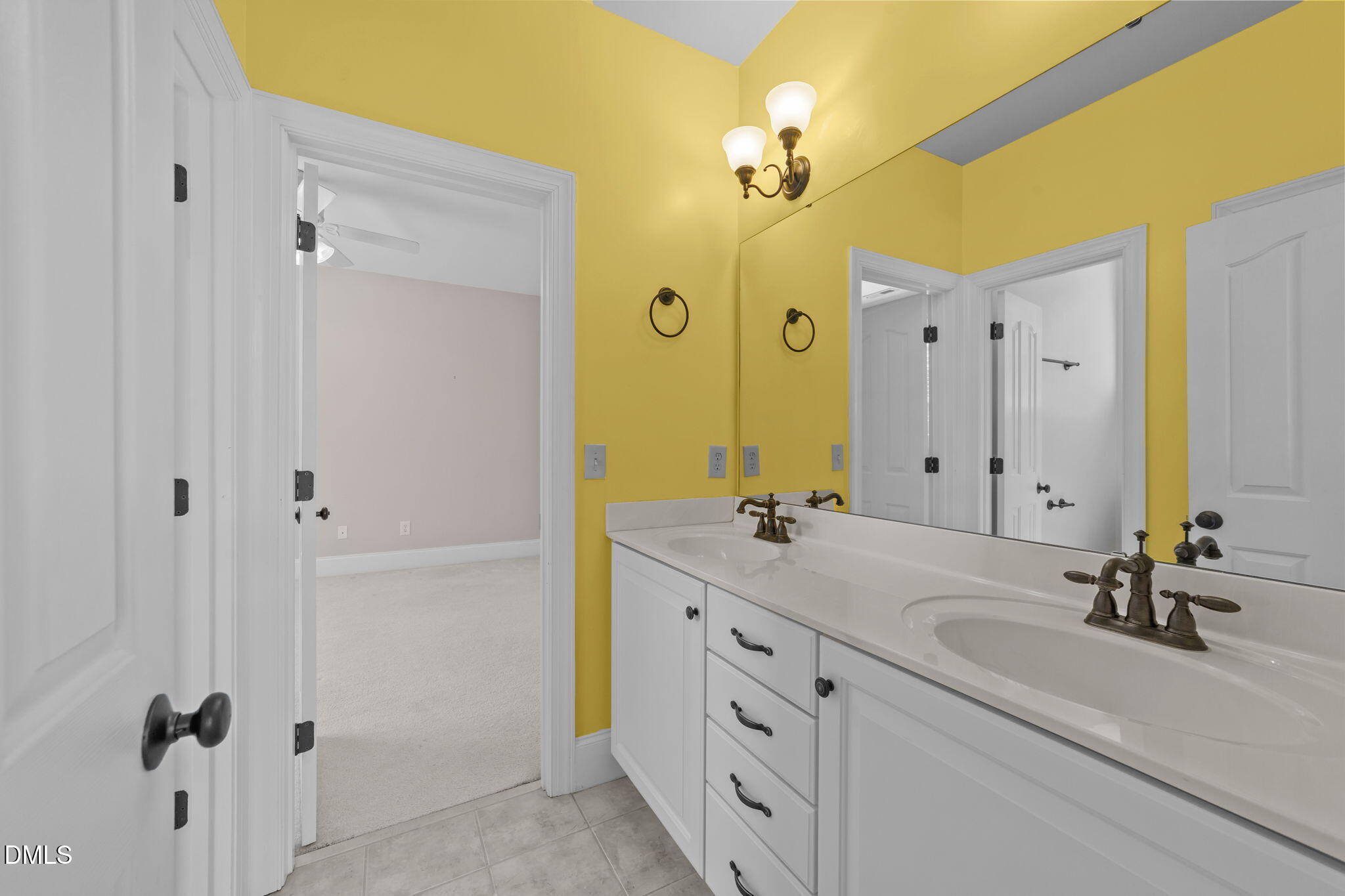 1405 Wakefield Farm Road Zebulon, NC 27597 - Photo 48 of 64 a bathroom with a double vanity sink mirror and shower