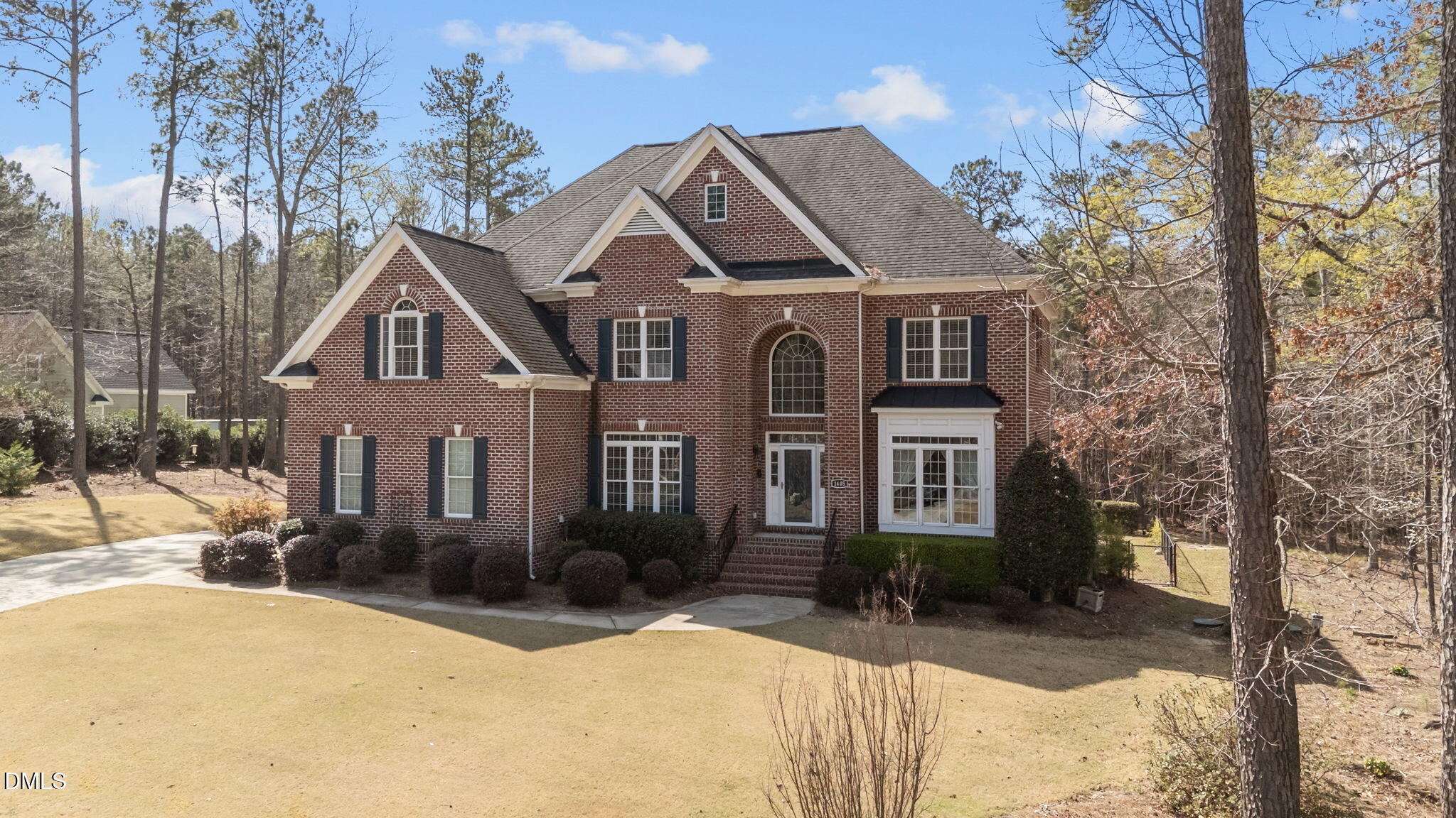 1405 Wakefield Farm Road Zebulon, NC 27597 - Photo 4 of 64 a front view of a house with a yard covered with snow