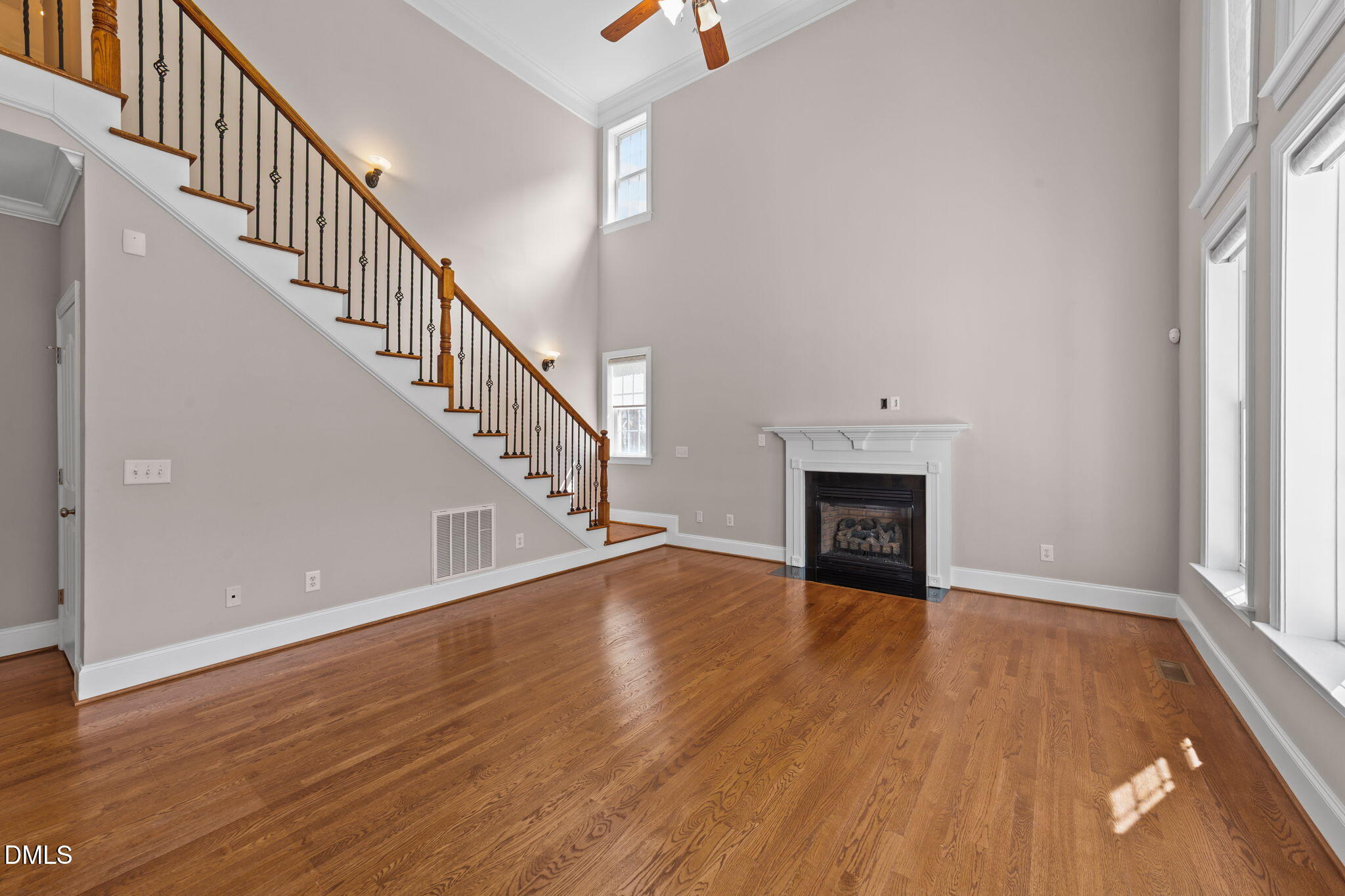 1405 Wakefield Farm Road Zebulon, NC 27597 - Photo 51 of 64 a view of empty room with wooden floor and fireplace