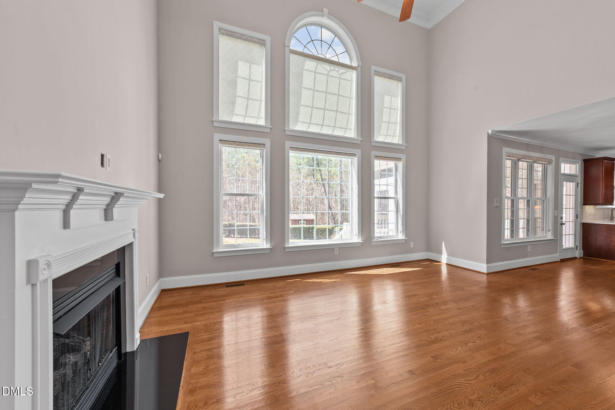 1405 Wakefield Farm Road Zebulon, NC 27597 - Photo 52 of 64 a view of an empty room with wooden floor and a window
