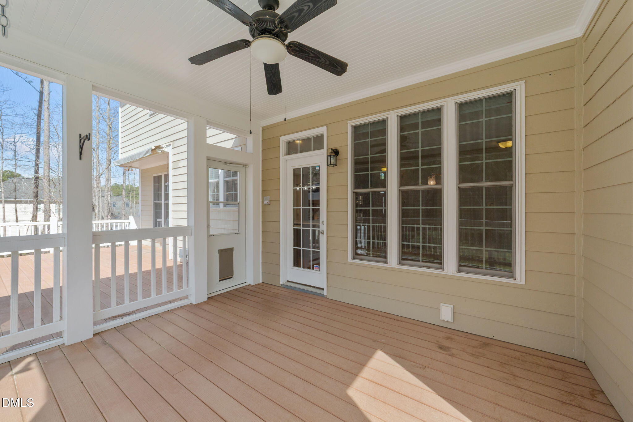 1405 Wakefield Farm Road Zebulon, NC 27597 - Photo 61 of 64 a view of an empty room with wooden floor and a window