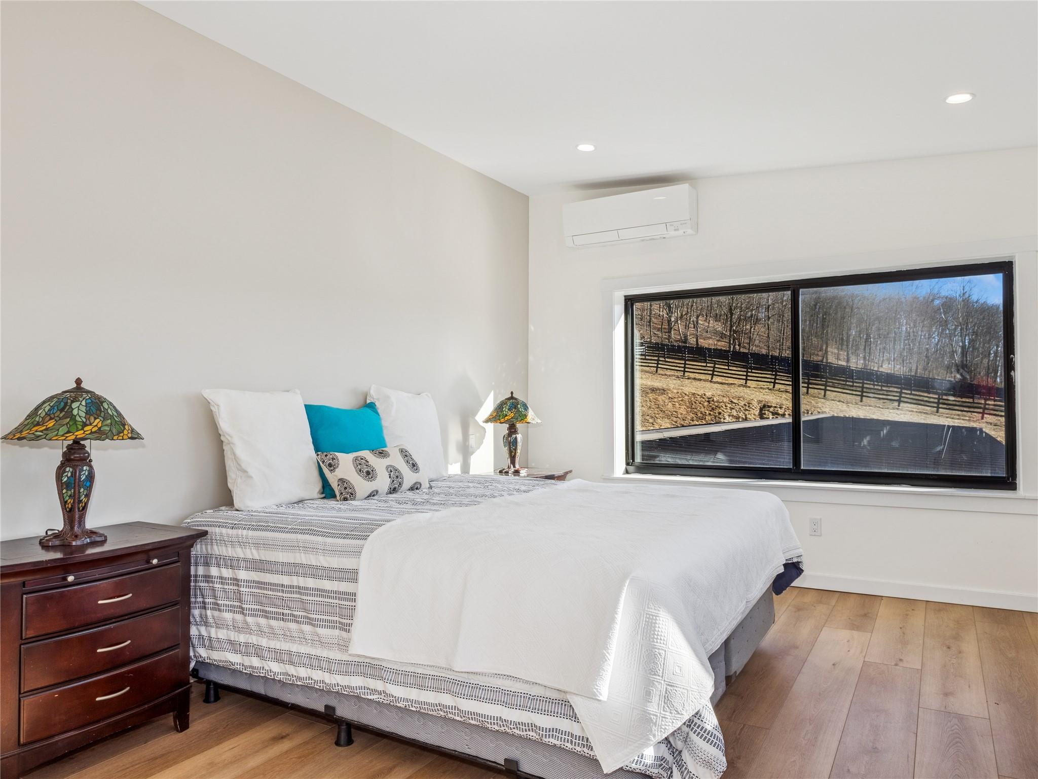 2680 Highway 9 Cold Spring, NY 10516 - Photo 11 of 29 a bedroom with a bed and a large window