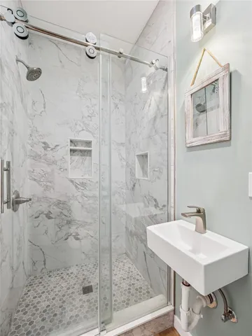 a bedroom with a bed and lamp