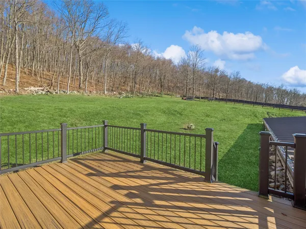 a view of a backyard with sitting area