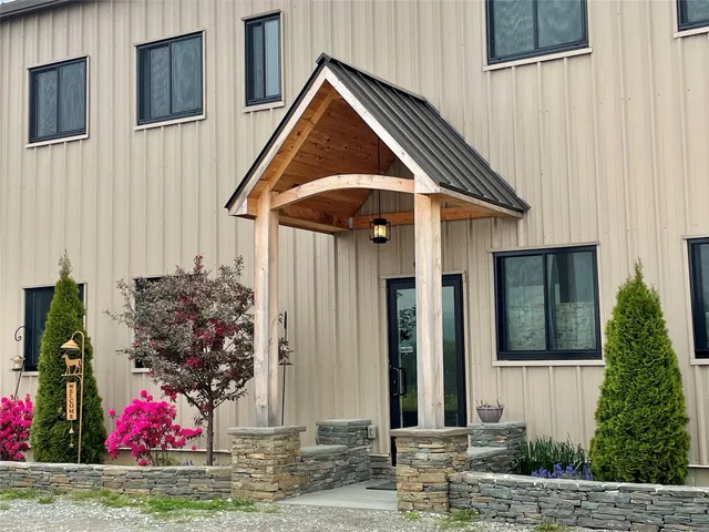 a front view of house with an outdoor space