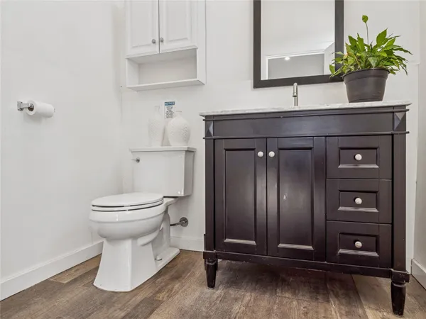 a bathroom with a toilet and a sink