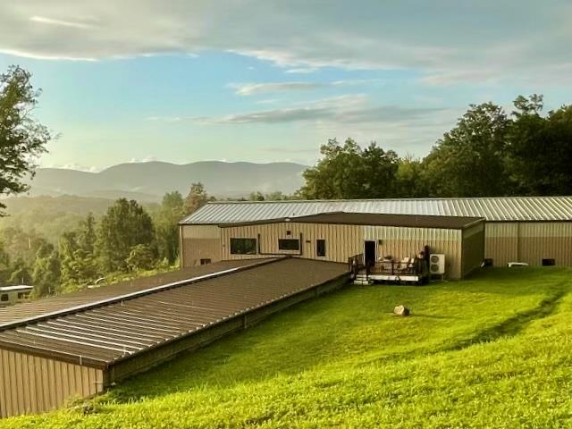 2680 Highway 9 Cold Spring, NY 10516 - Photo 9 of 29 a view of a lake with lawn chairs and a table