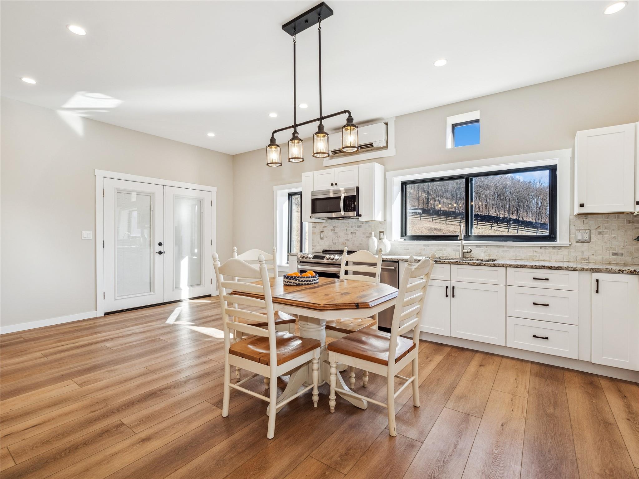 2680 Highway 9 Cold Spring, NY 10516 - Photo 28 of 29 a view of a dining room with furniture wooden floor and chandelier