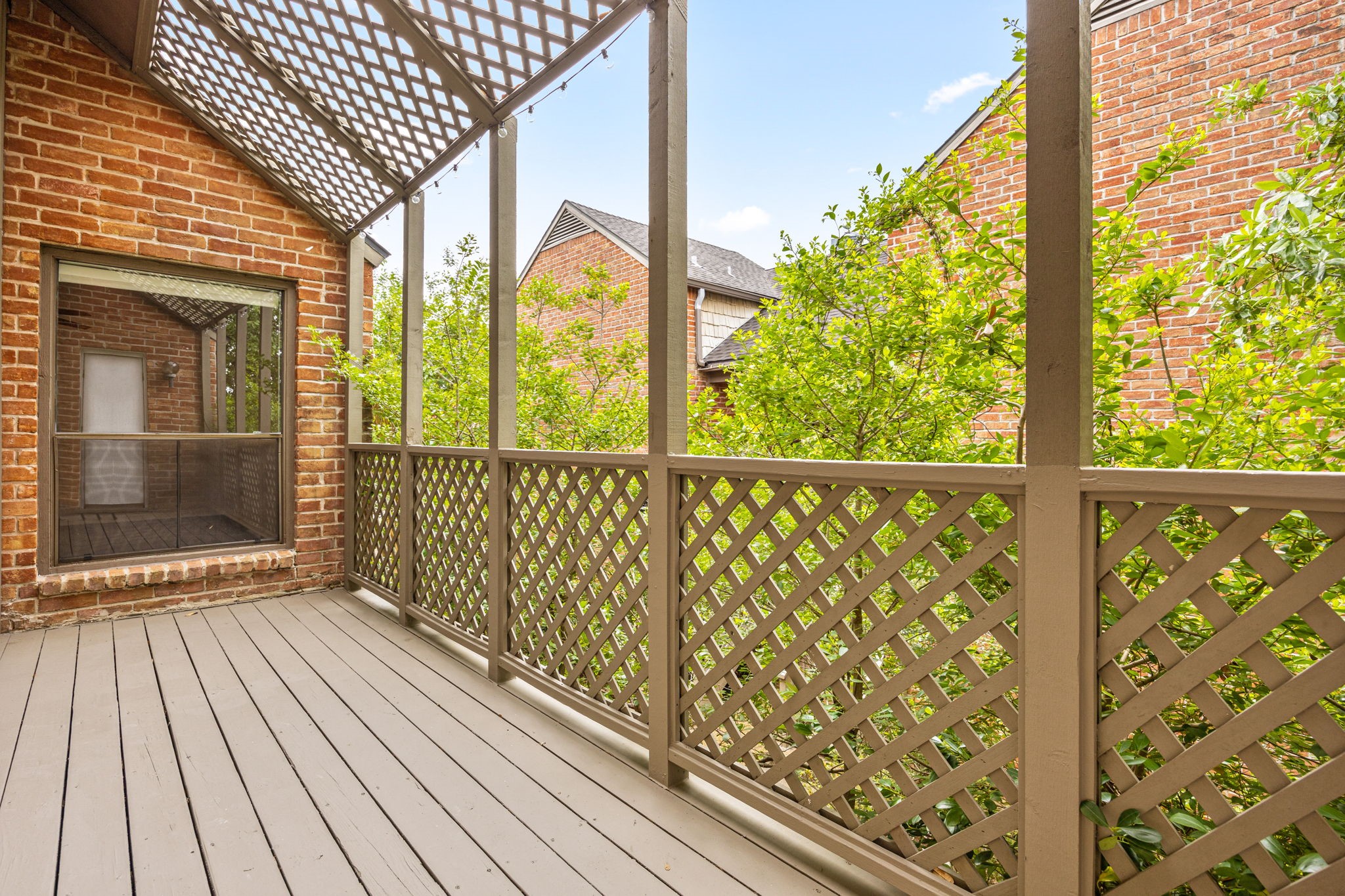 2829 Timmons Lane, Unit 130 Houston, TX 77027 - Photo 19 of 23 a view of a balcony with wooden floor