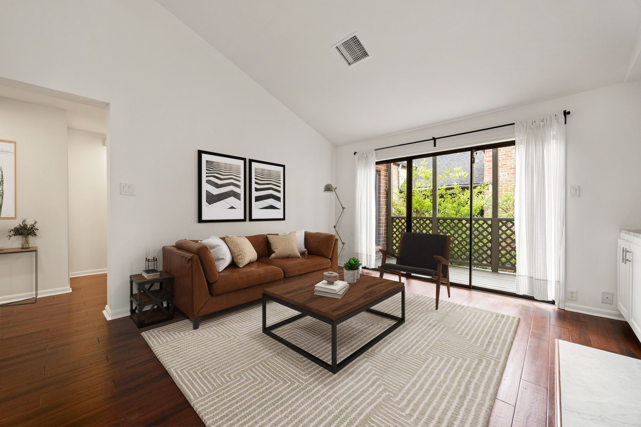 2829 Timmons Lane, Unit 130 Houston, TX 77027 - Photo 3 of 23 a living room with furniture and a large window