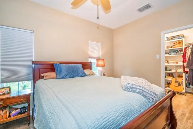 a bedroom with a bed and a dresser