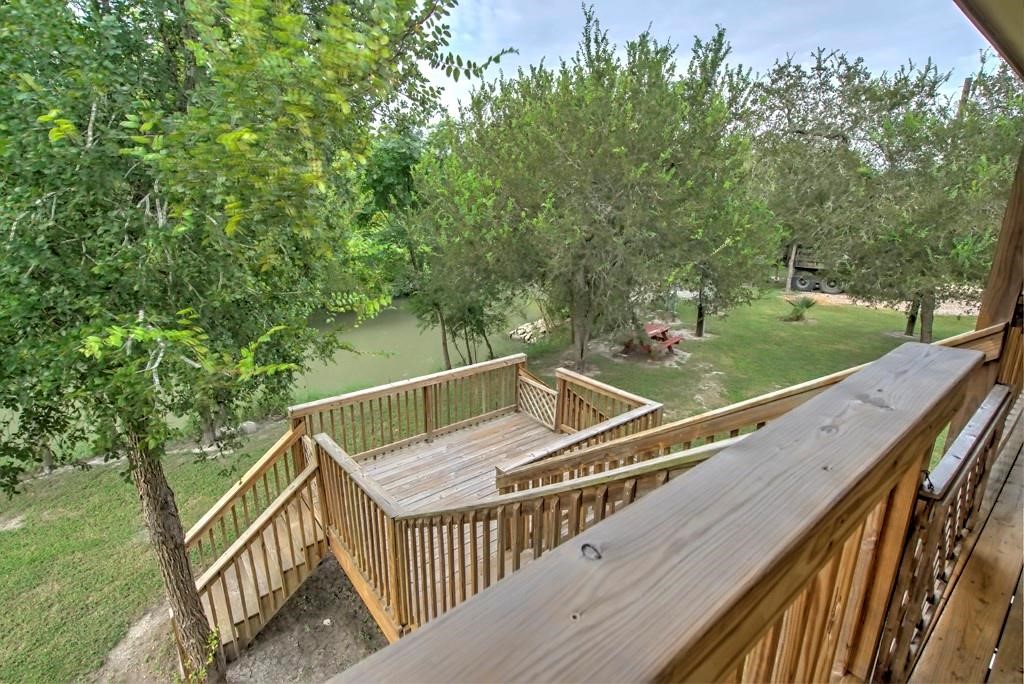 6026 County Road 73 Robstown, TX 78380 - Photo 19 of 30 a balcony with trees in front of it