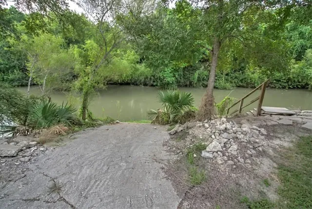 a view of a yard with wooden floor and lake view