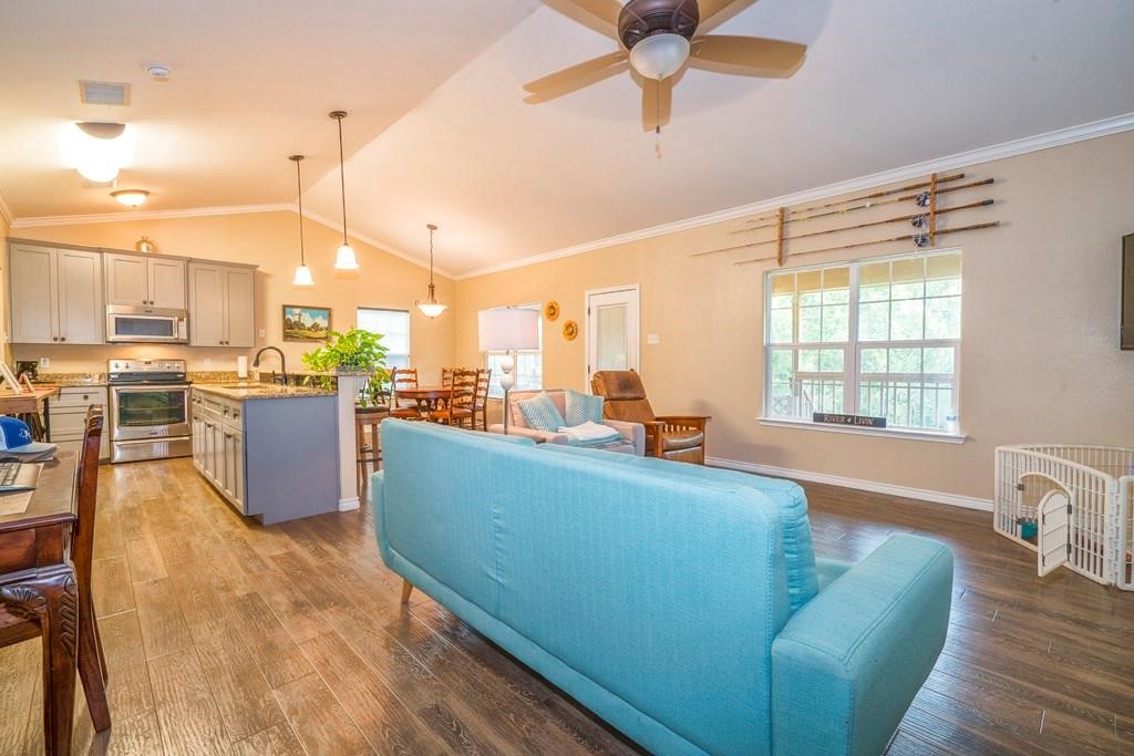 6026 County Road 73 Robstown, TX 78380 - Photo 5 of 30 a living room with furniture and a large window