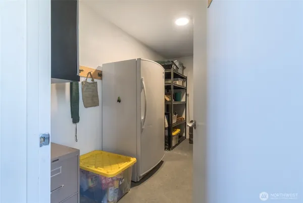 a bathroom with a granite countertop shower and a sink