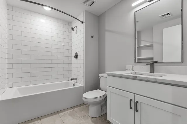 a bathroom with a toilet a sink and a bathtub