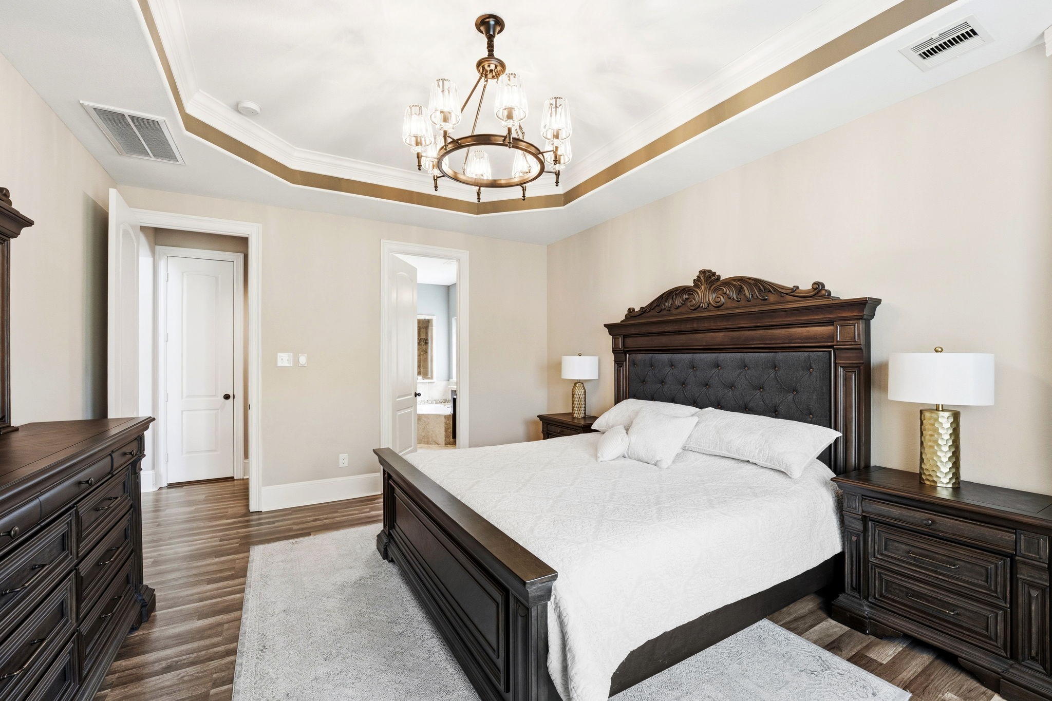 27383 Pendleton Trace Drive Spring, TX 77386 - Photo 14 of 33 Notice the elegant chandelier in the primary bedroom.