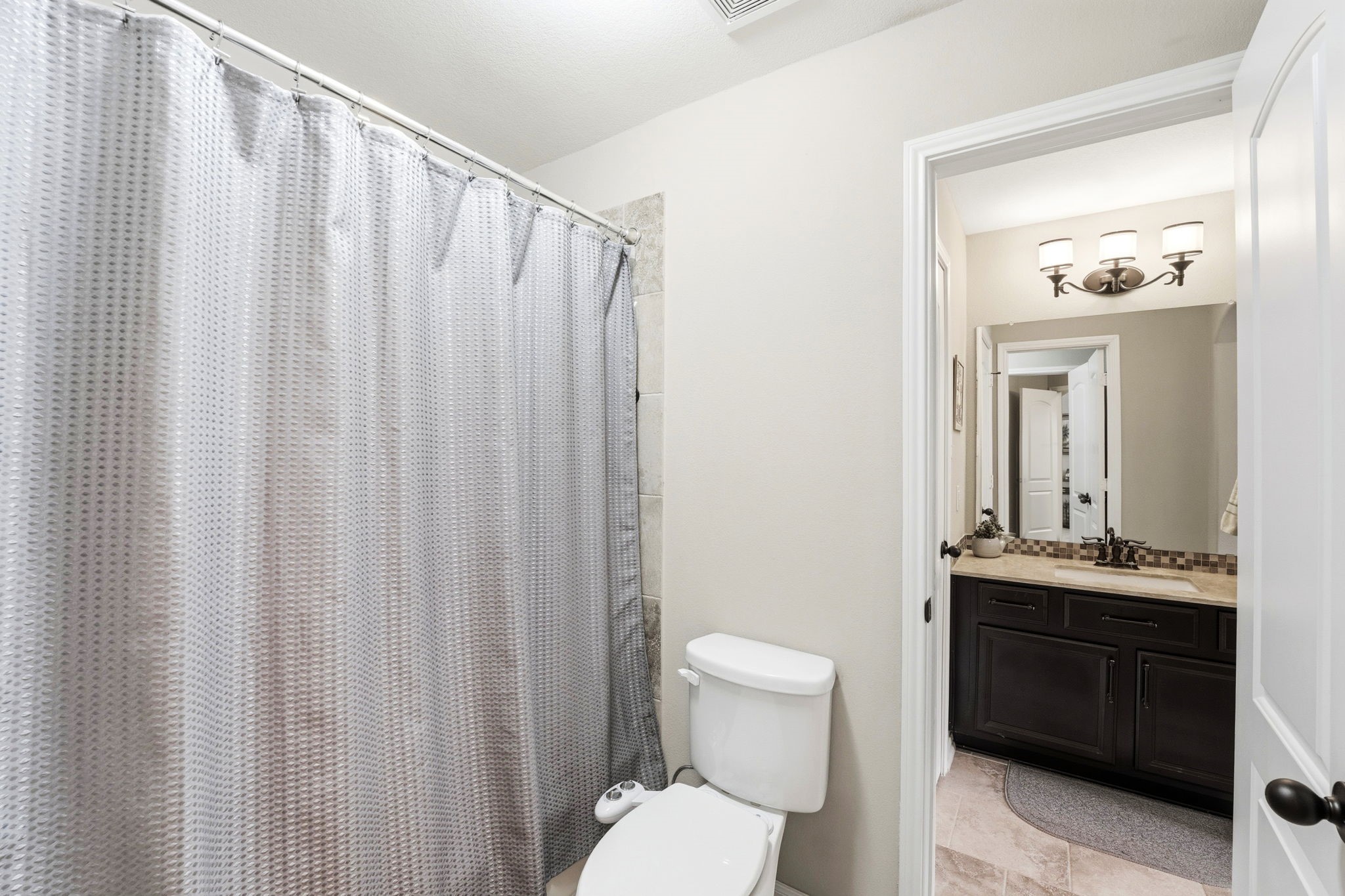 27383 Pendleton Trace Drive Spring, TX 77386 - Photo 25 of 33 Combination shower/tub in the Jack and Jill bedroom.