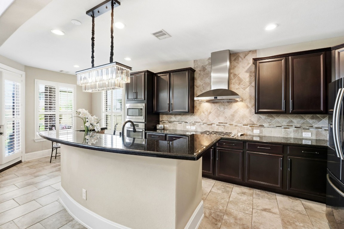 27383 Pendleton Trace Drive Spring, TX 77386 - Photo 5 of 33 Center island kitchen with stunning pendant lighting.