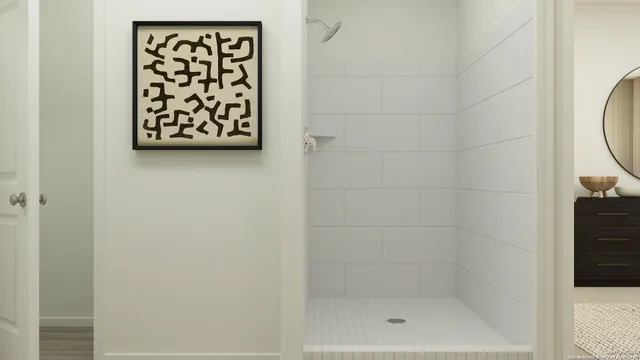 a bathroom with a shower and a sink