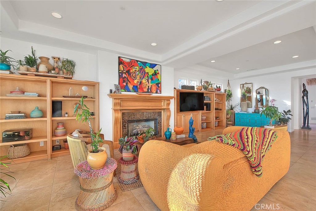 35177 Beach Road Dana Point, CA 92624 - Photo 17 of 66 a living room with fireplace furniture and a flat screen tv