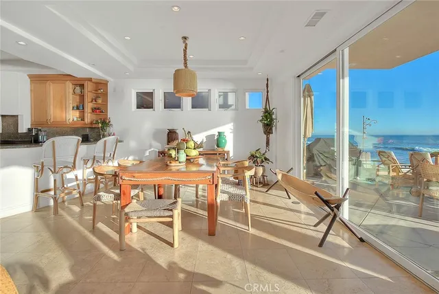a living room with furniture a window and kitchen view