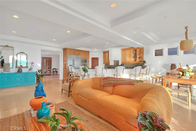 a kitchen with stainless steel appliances granite countertop a sink and a refrigerator