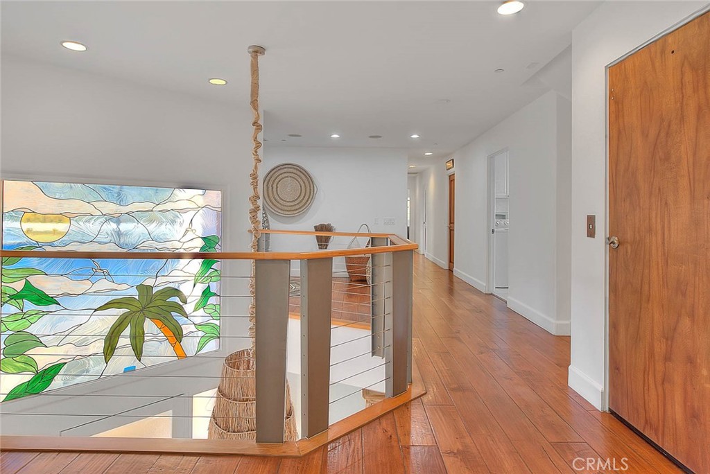 35177 Beach Road Dana Point, CA 92624 - Photo 28 of 66 a view of a hallway with wooden floor