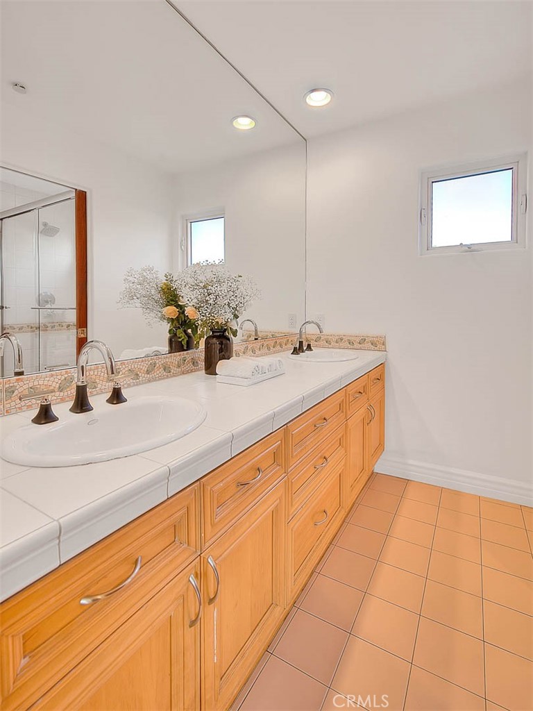 35177 Beach Road Dana Point, CA 92624 - Photo 41 of 66 a bathroom with a sink and a mirror