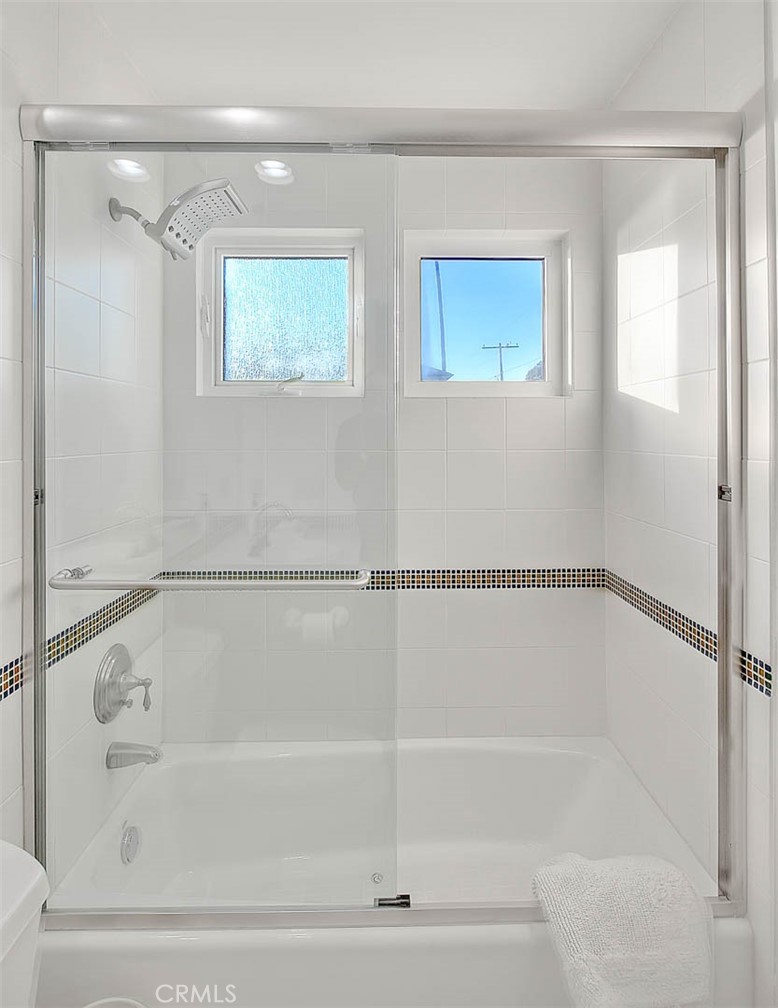 35177 Beach Road Dana Point, CA 92624 - Photo 44 of 66 a bathroom with a shower and a bath tub