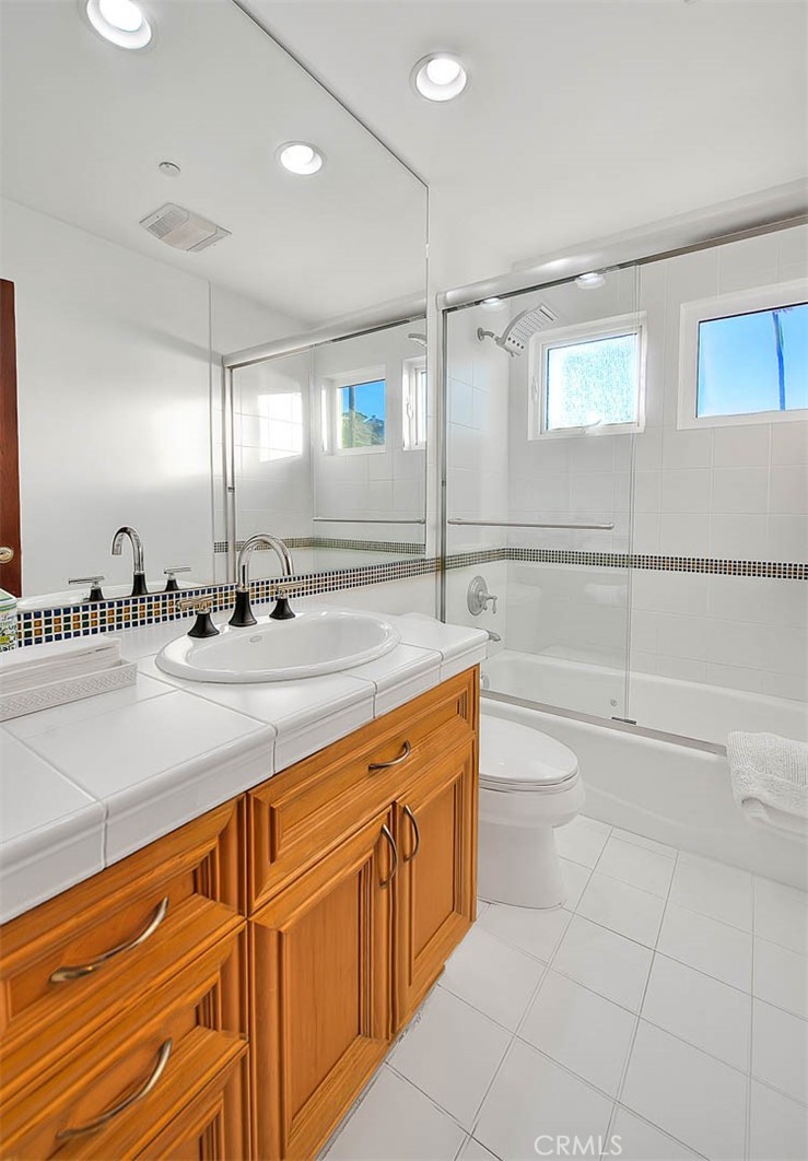 35177 Beach Road Dana Point, CA 92624 - Photo 45 of 66 a bathroom with a sink a toilet and shower