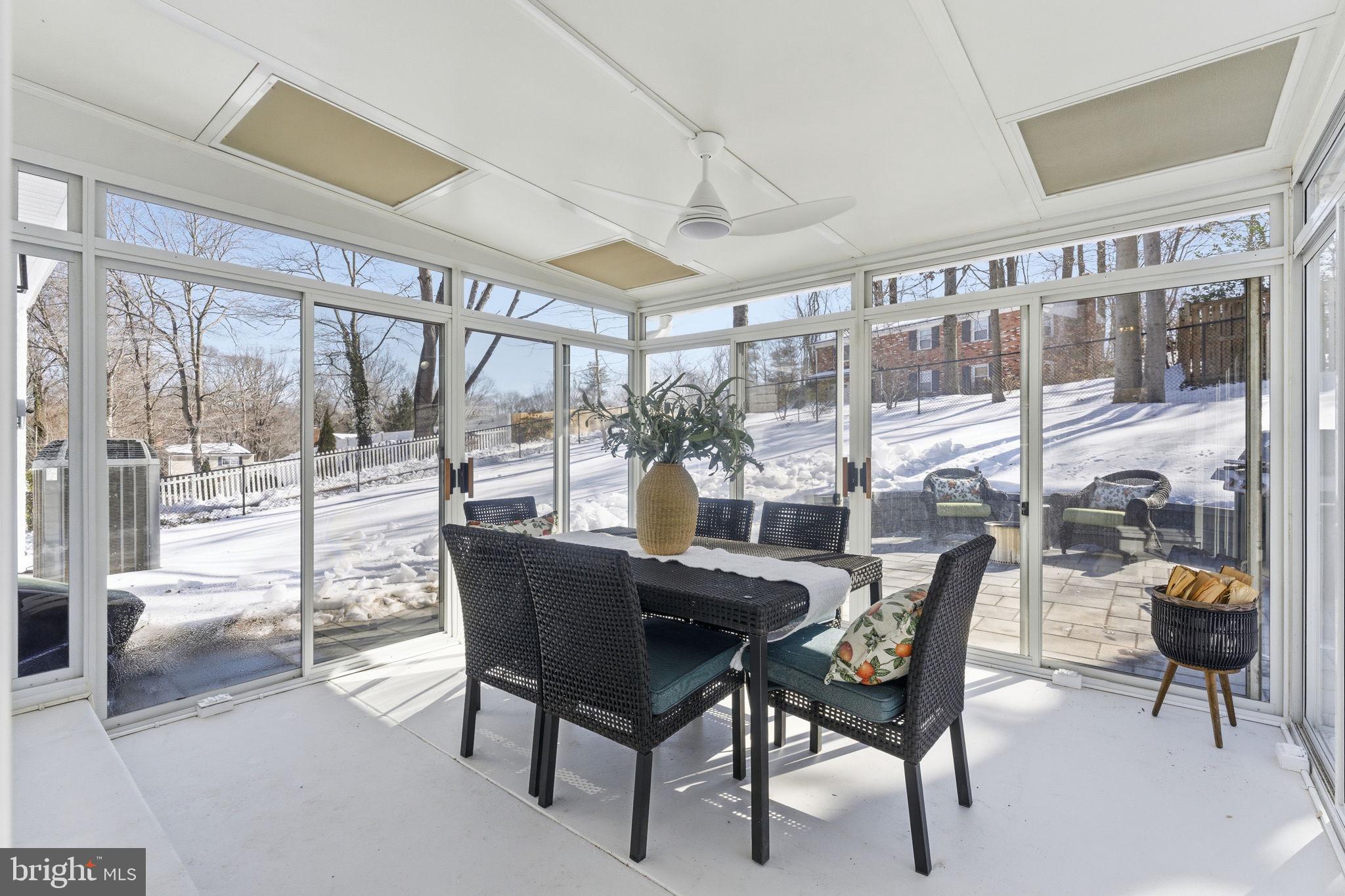 8615 Kerry Lane Springfield, VA 22152 - Photo 44 of 50 a dining room with furniture and a floor to ceiling window