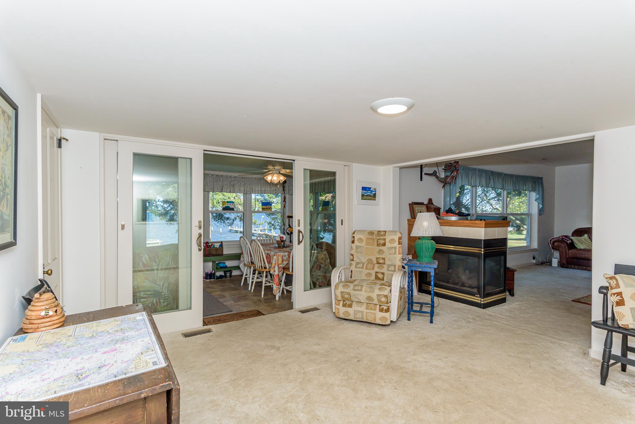 26388 Mt Vernon Road Princess Anne, MD 21853 - Photo 28 of 43 a living room with furniture and a fireplace