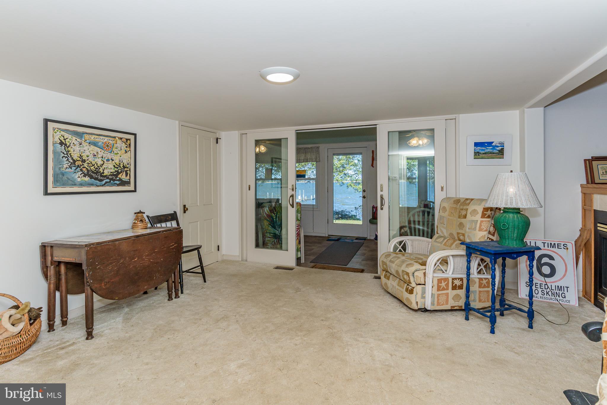 26388 Mt Vernon Road Princess Anne, MD 21853 - Photo 29 of 43 a living room with furniture and a potted plant