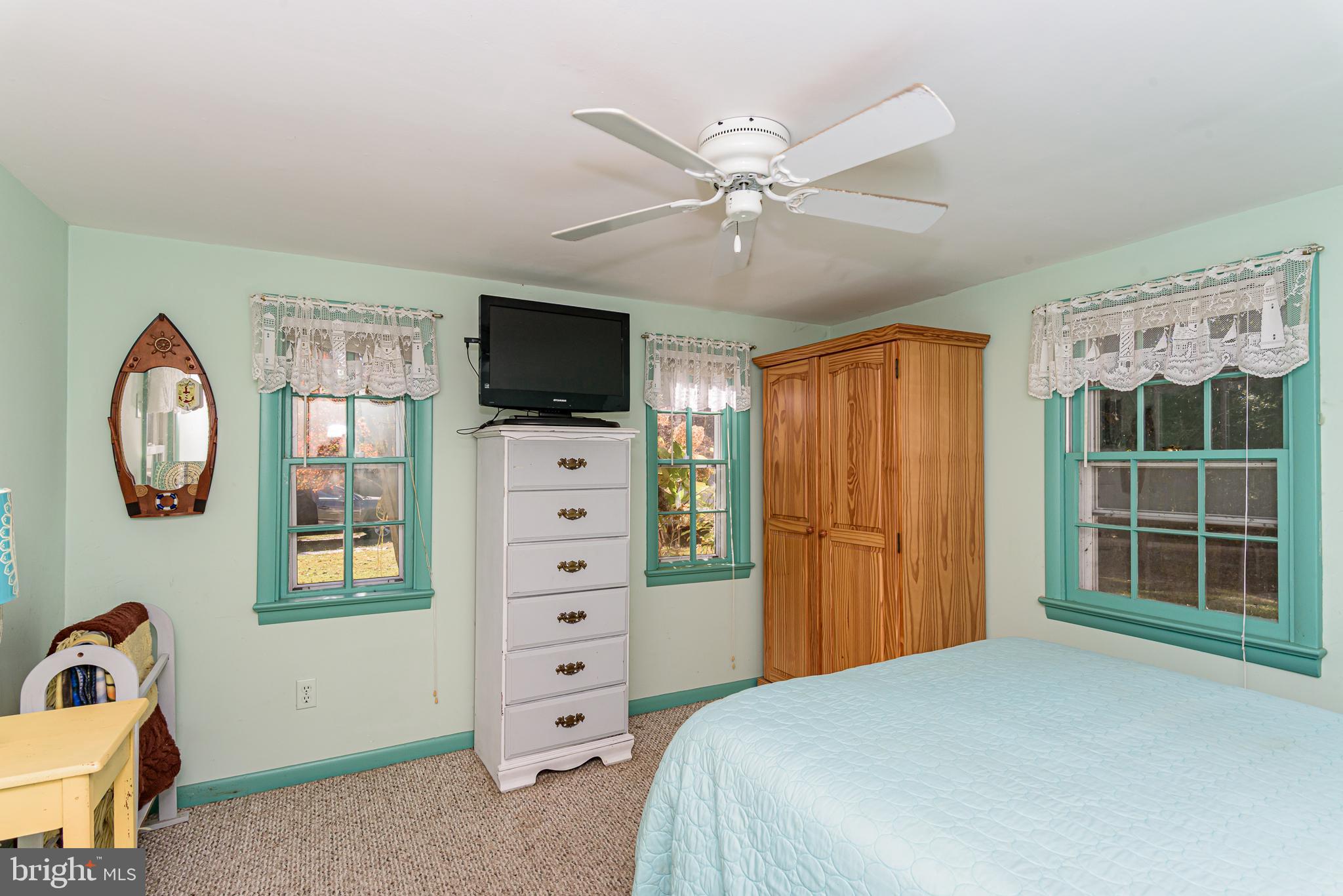 26388 Mt Vernon Road Princess Anne, MD 21853 - Photo 37 of 43 a bedroom with a bed and a television