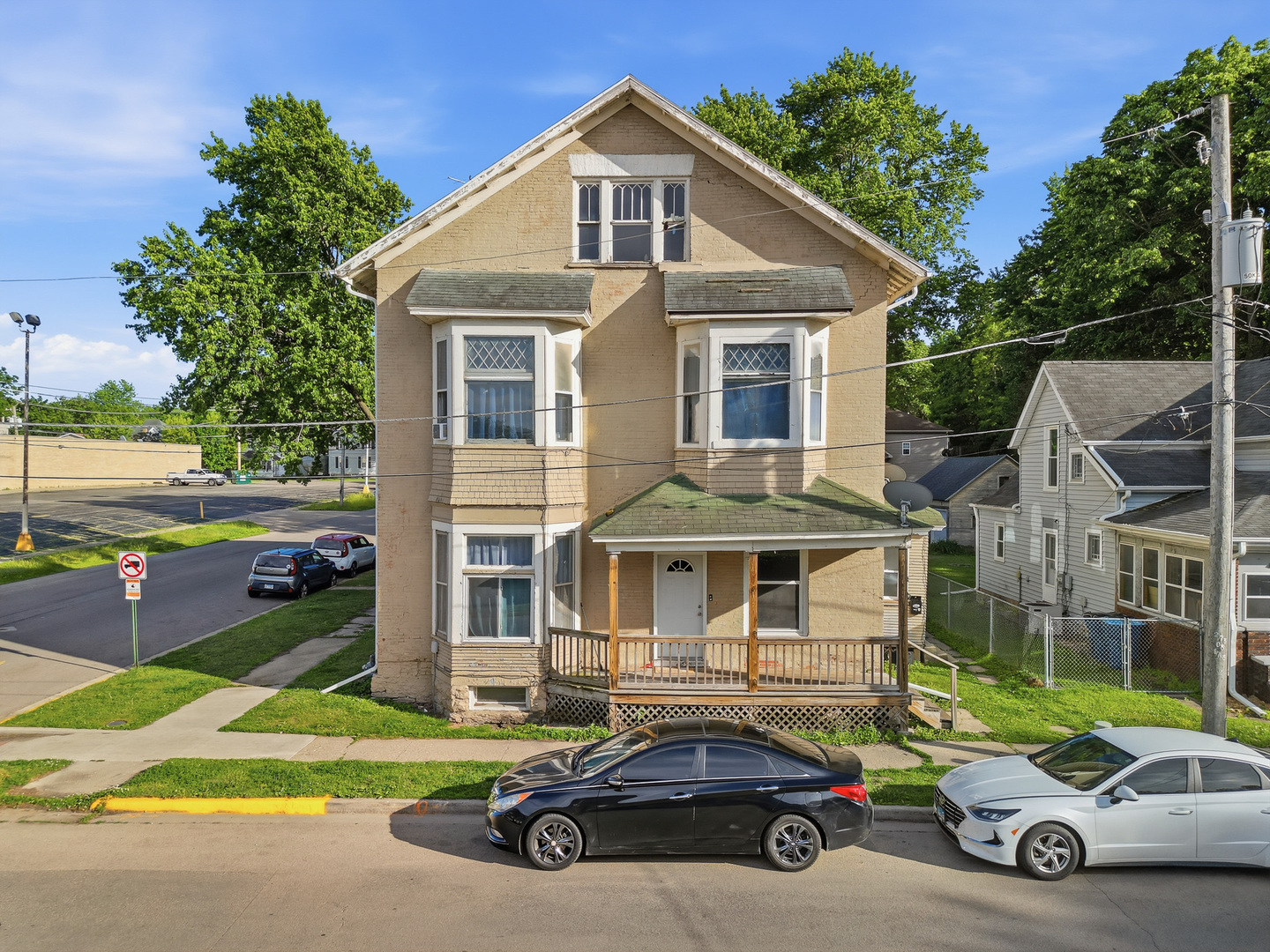 305 Monroe Avenue Dixon, IL 61021 - Photo 2 of 36 a car parked in front of a house