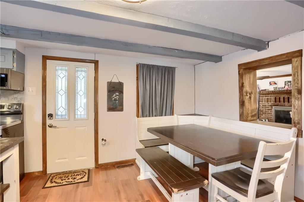 1923 Martin Road New Castle, PA 16101 - Photo 6 of 25 a view of a dining room with furniture and wooden floor
