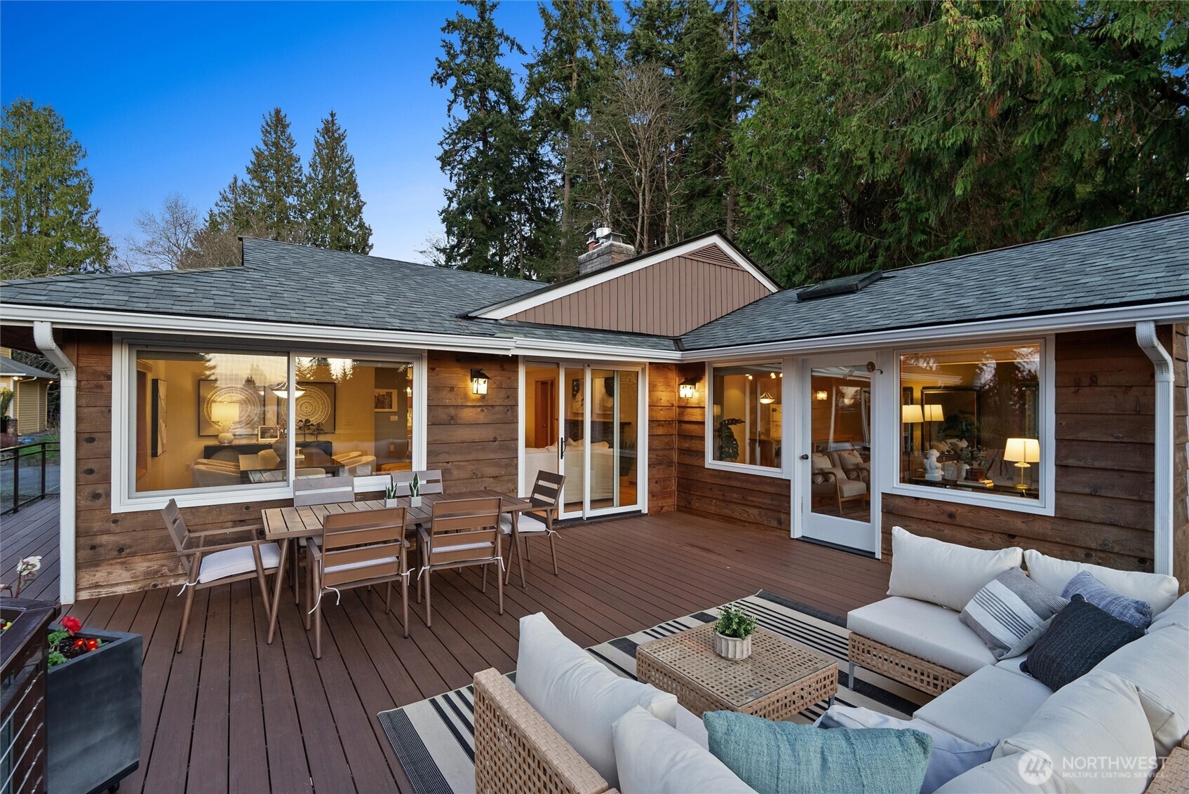 18431 High Street Edmonds, WA 98020 - Photo 15 of 40 a view of a patio with couches table and chairs and potted plants