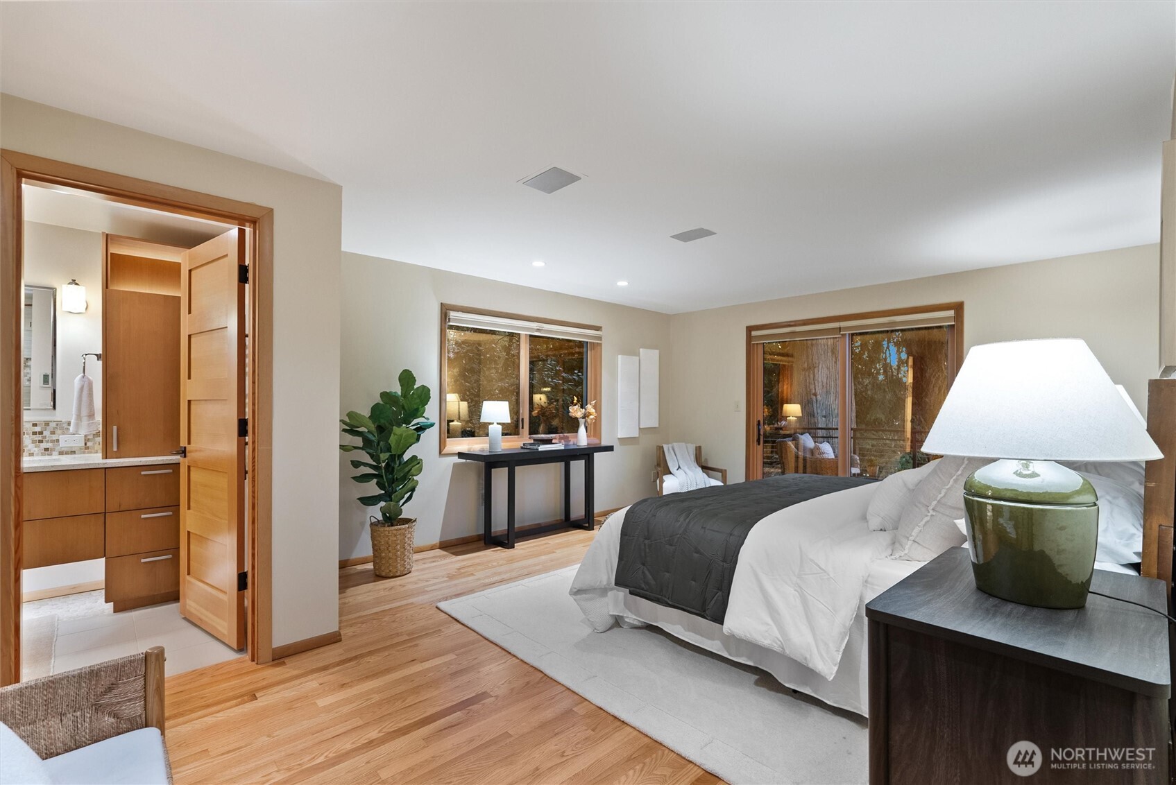 18431 High Street Edmonds, WA 98020 - Photo 17 of 40 a bedroom with a bed and a table