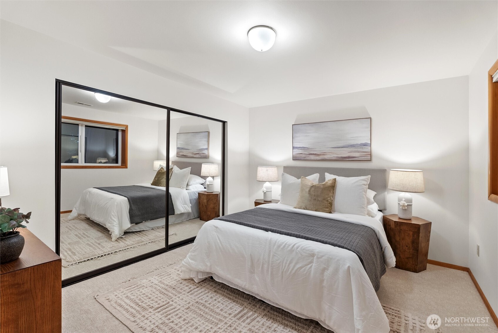 18431 High Street Edmonds, WA 98020 - Photo 24 of 40 a bedroom with a large bed and a couch